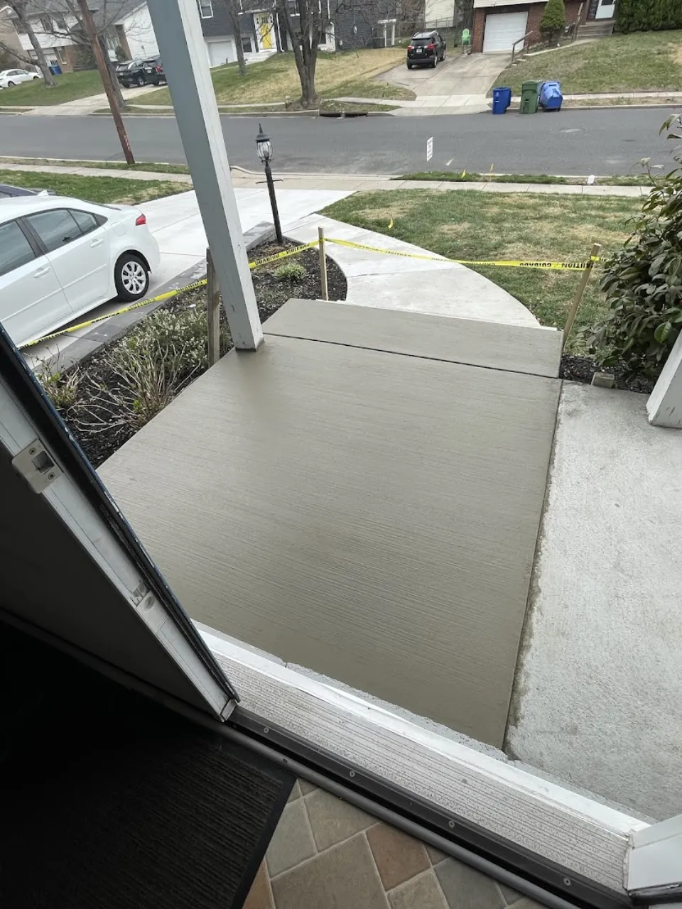 Fresh broom-finish concrete front walkway and landing at a Cherry Hill home